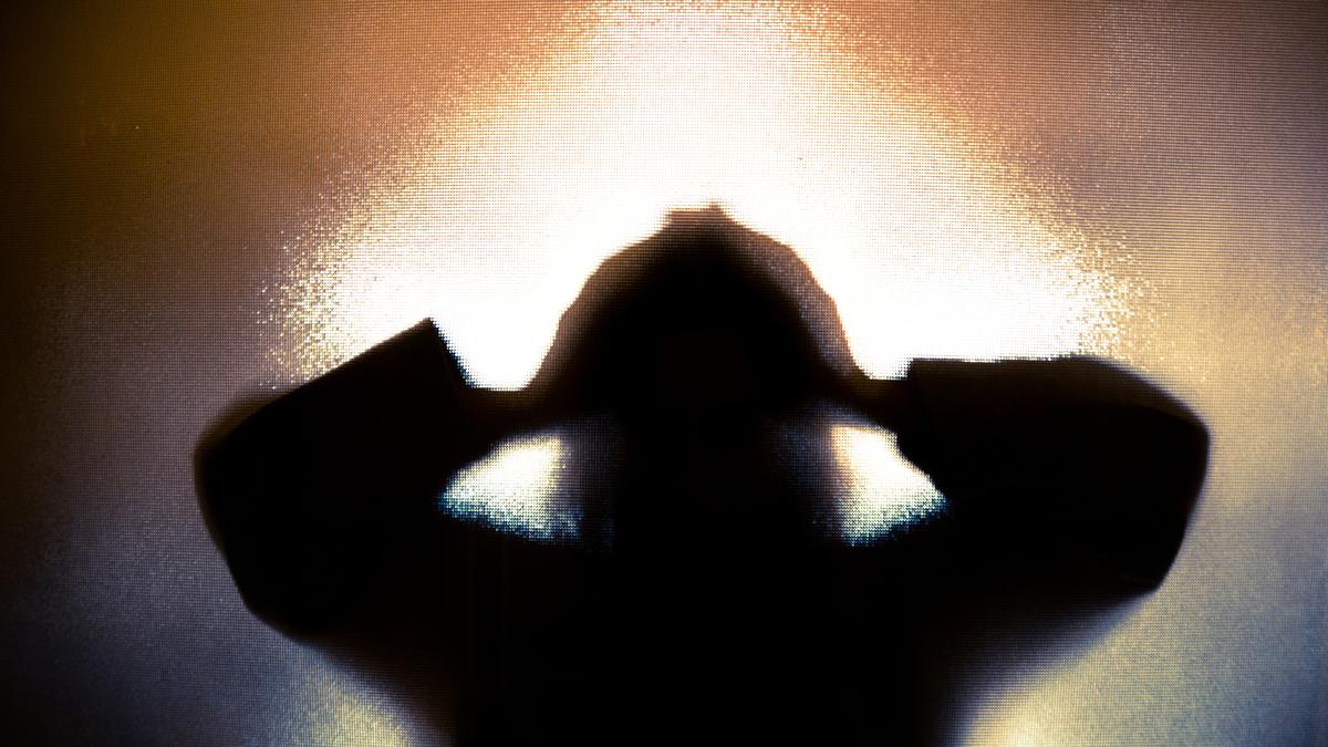 Protesters holding placards against alleged college cover-up in Andhra Pradesh